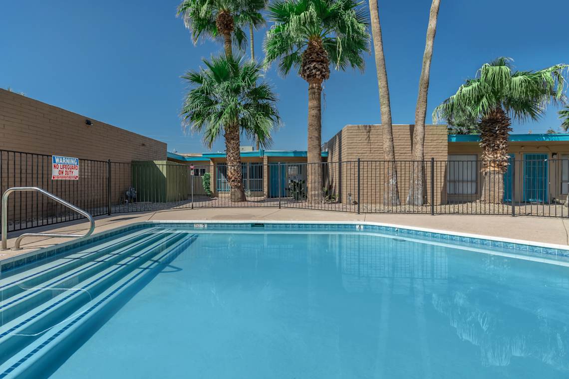 Pool and poolside area at The Cara Apartments.