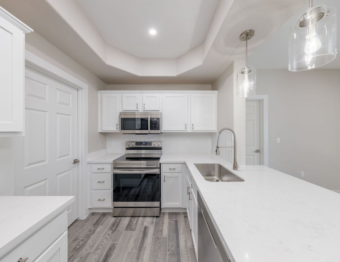 Apartment kitchen — representative home at Cordillera.
