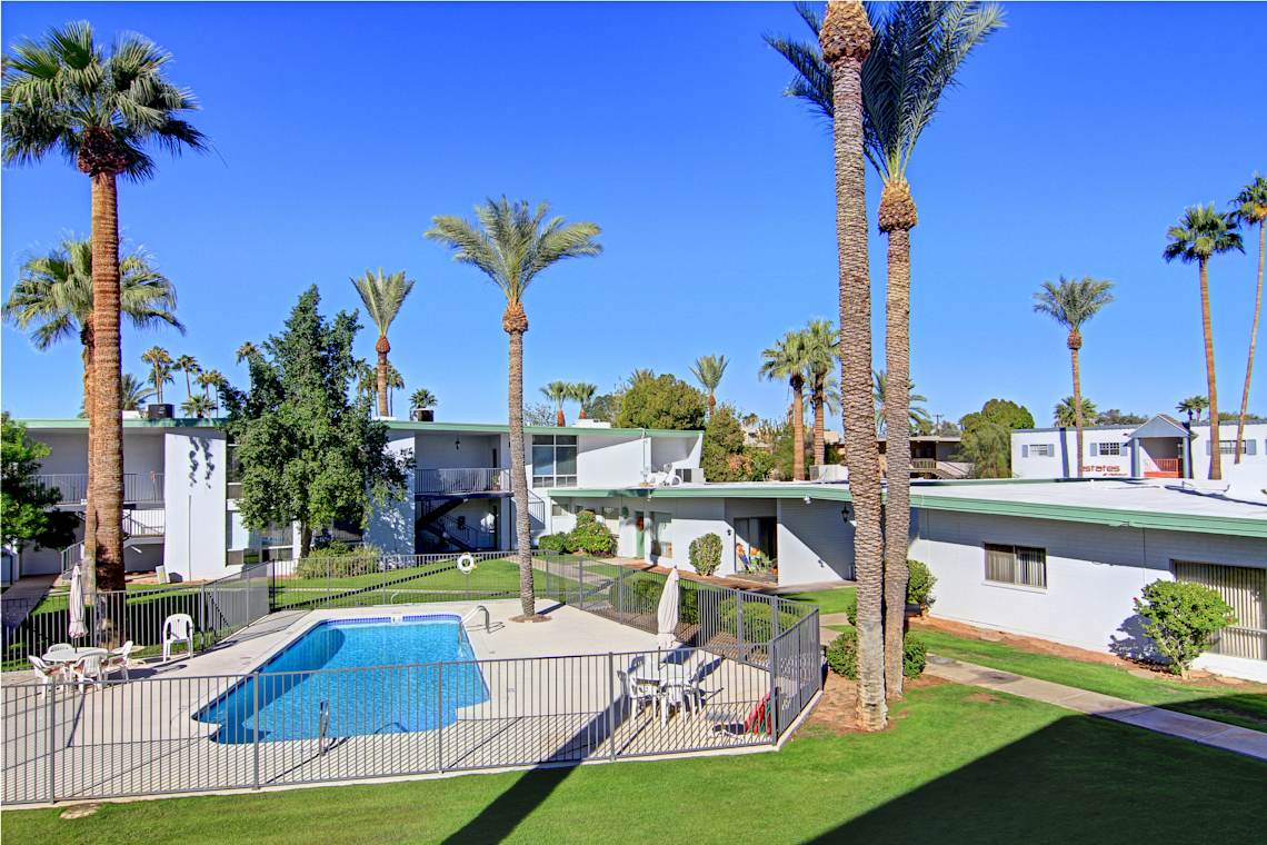 Pool and poolside area at Saxony Apartments.