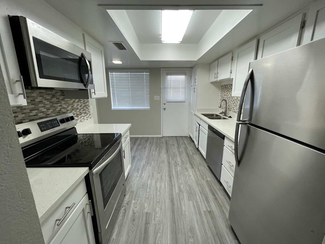 Apartment kitchen — representative home at The Earll.