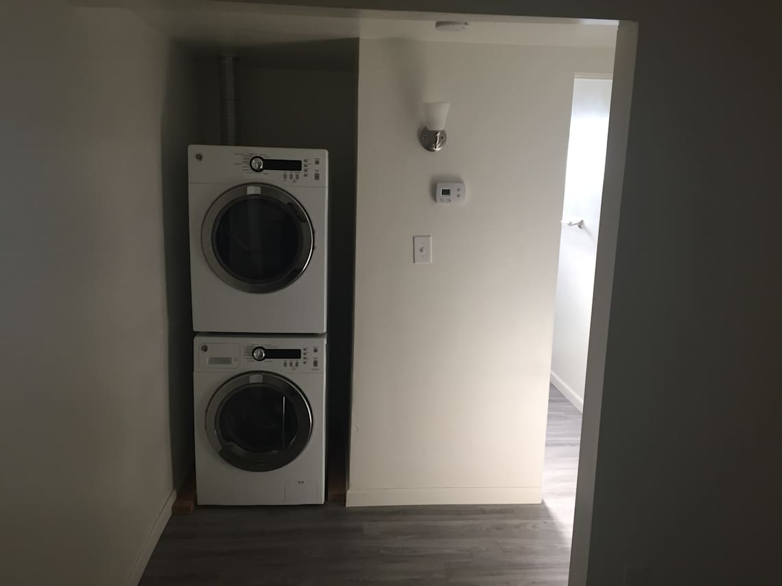 In-home laundry area at Saxony Apartments.