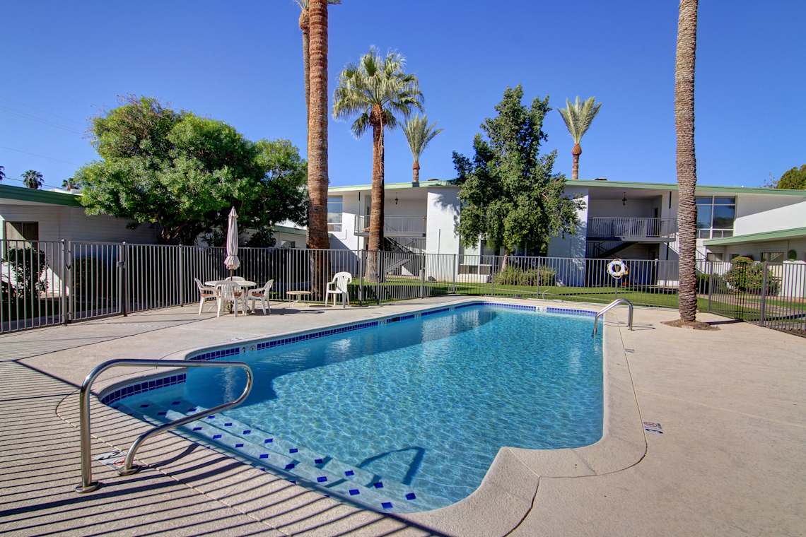 Pool and poolside area at Saxony Apartments.