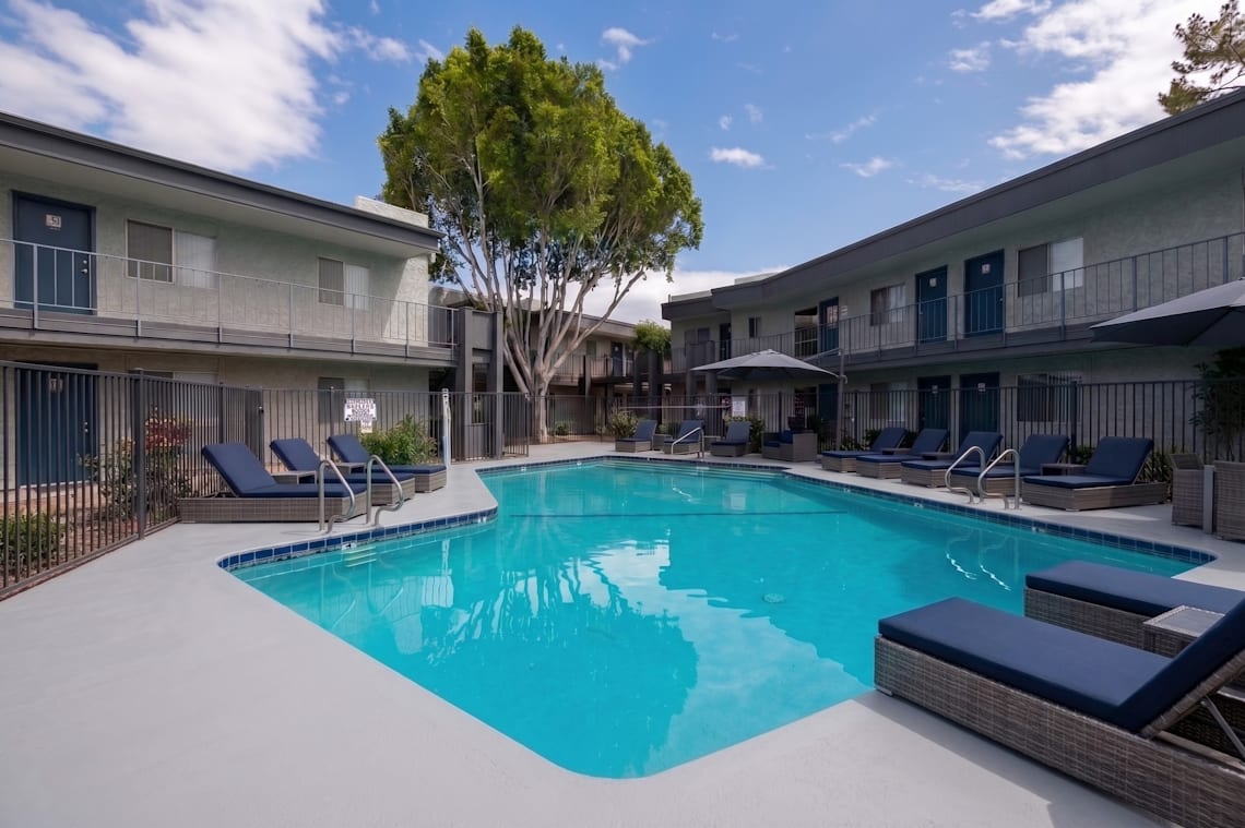 Pool and poolside area at Camelback Cove Apartments.