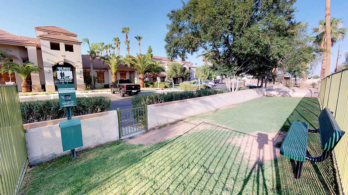 Enclosed dog exercise area at Cortina Apartments.