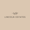 the logo estates on a beige background