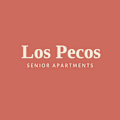 A sign that says Los Pecos Senior Apartments.