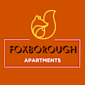 a logo apartments on an orange background