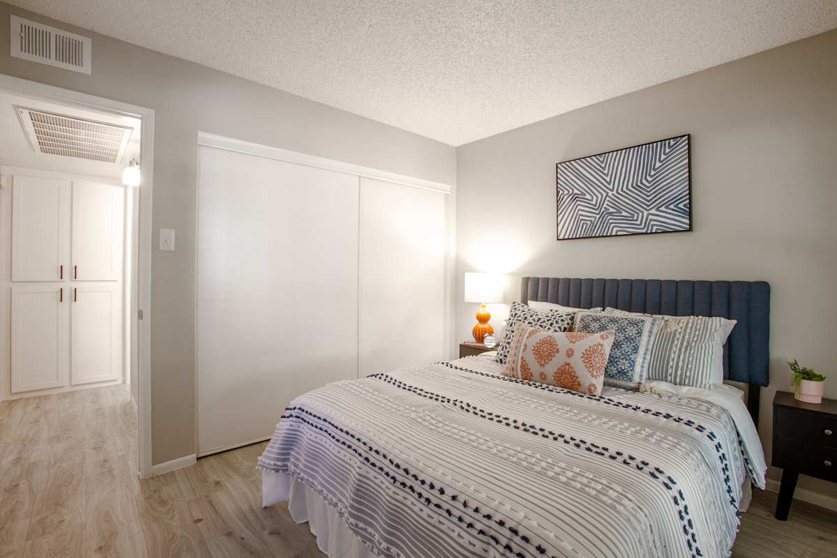 Furnished bedroom shown — representative home at Ascent on Peoria.