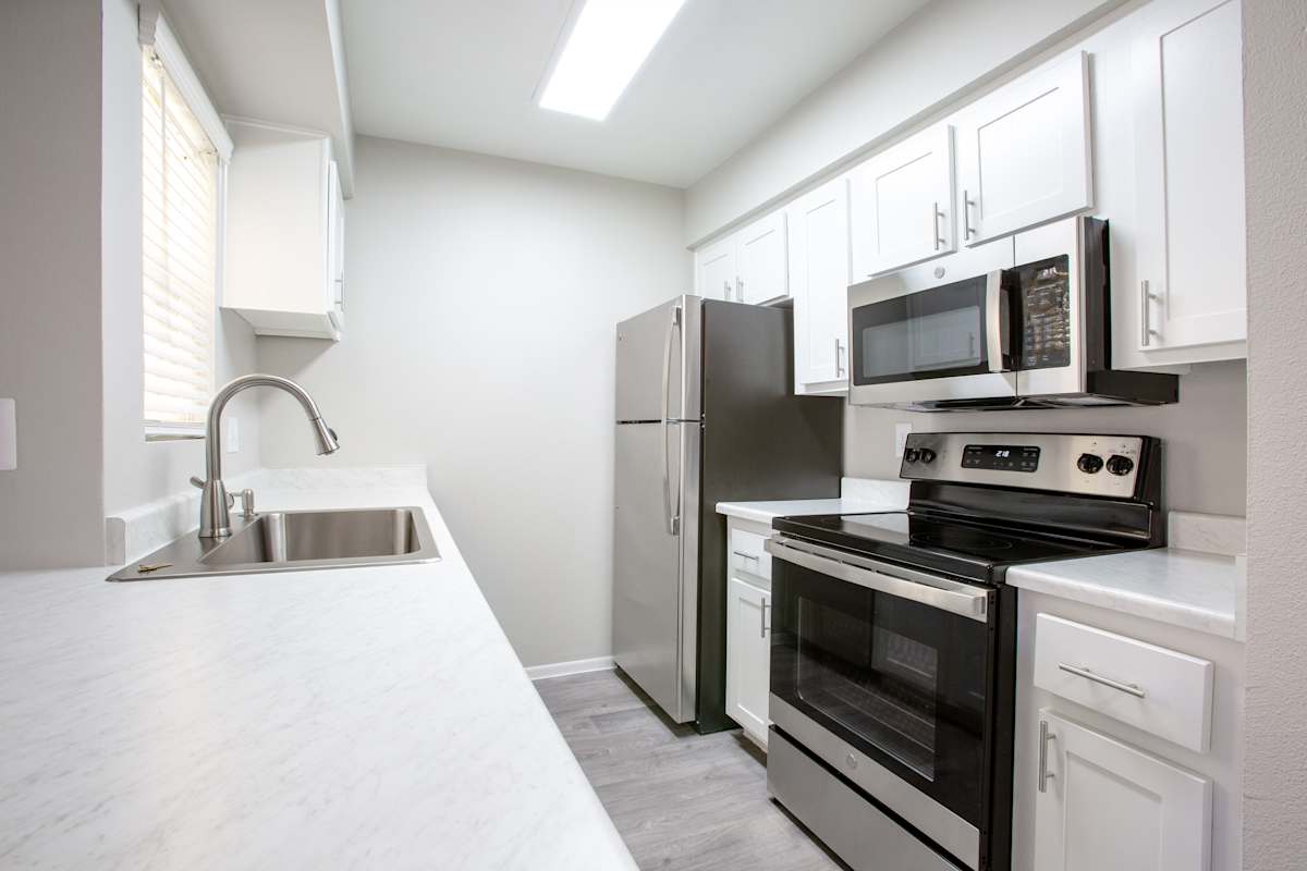 Apartment kitchen — representative home at Ascent on Peoria.