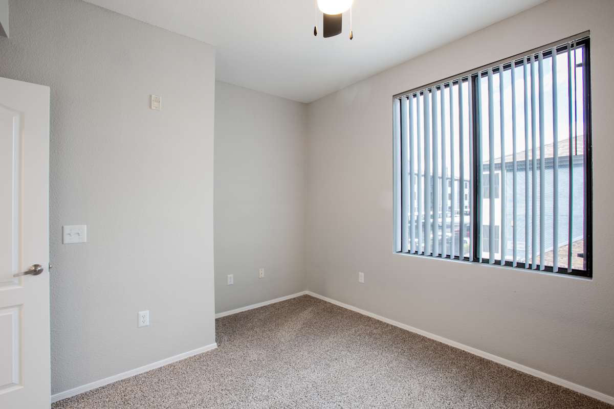 Unfurnished room with ceiling fan at Ascent North Scottsdale.