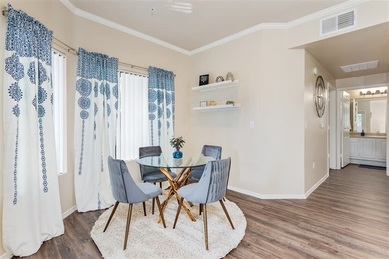Furnished dining area shown — representative home at San Riva At The Foothills.