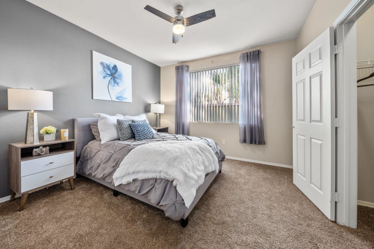 Furnished bedroom shown — representative home at San Riva At The Foothills.