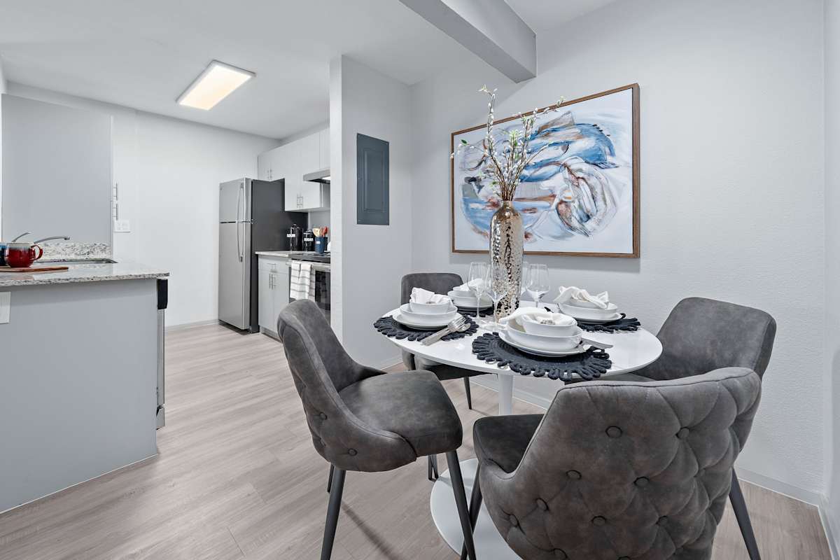 Furnished dining area shown — representative home at The Halifax.