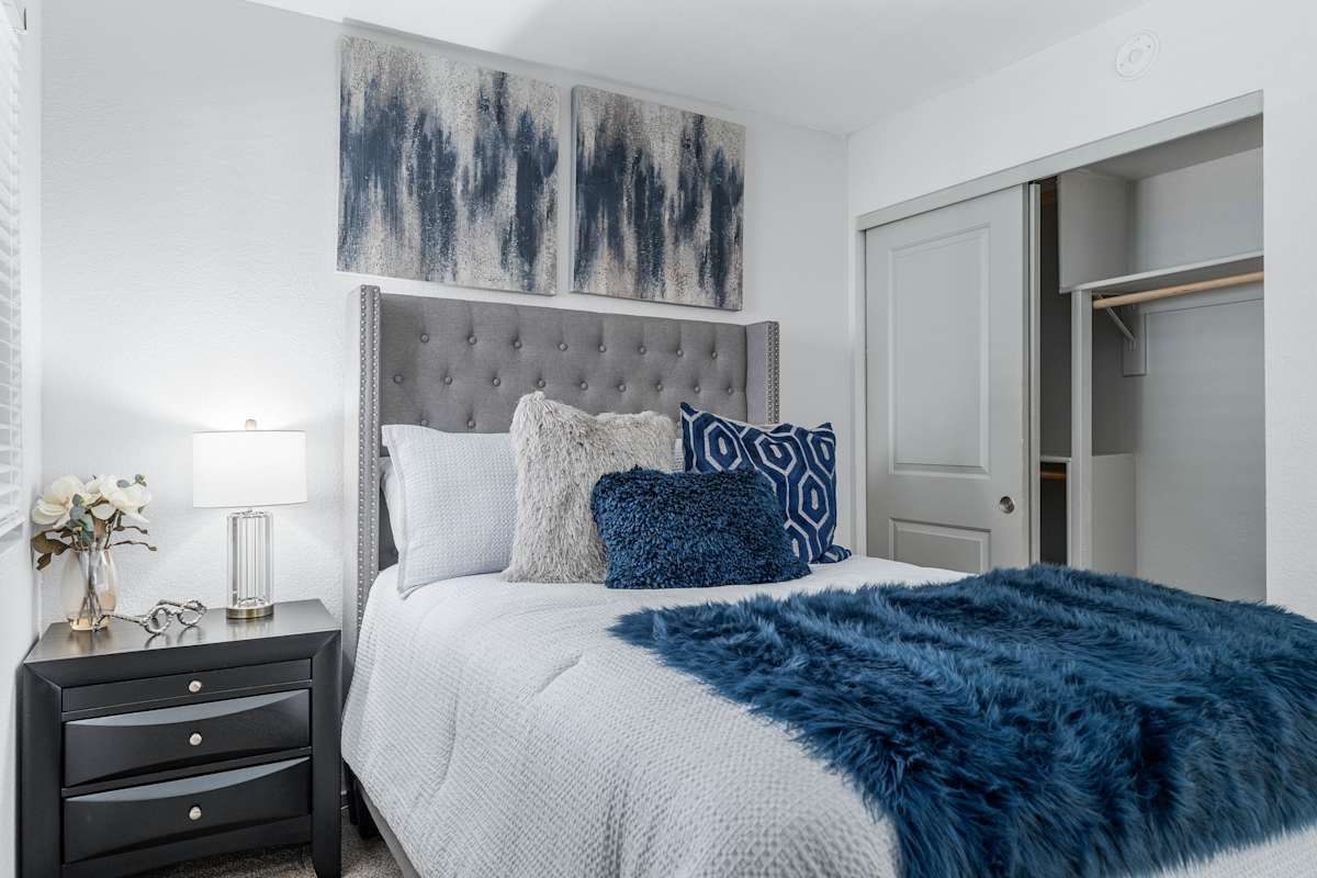 Furnished bedroom shown — representative home at The Halifax.