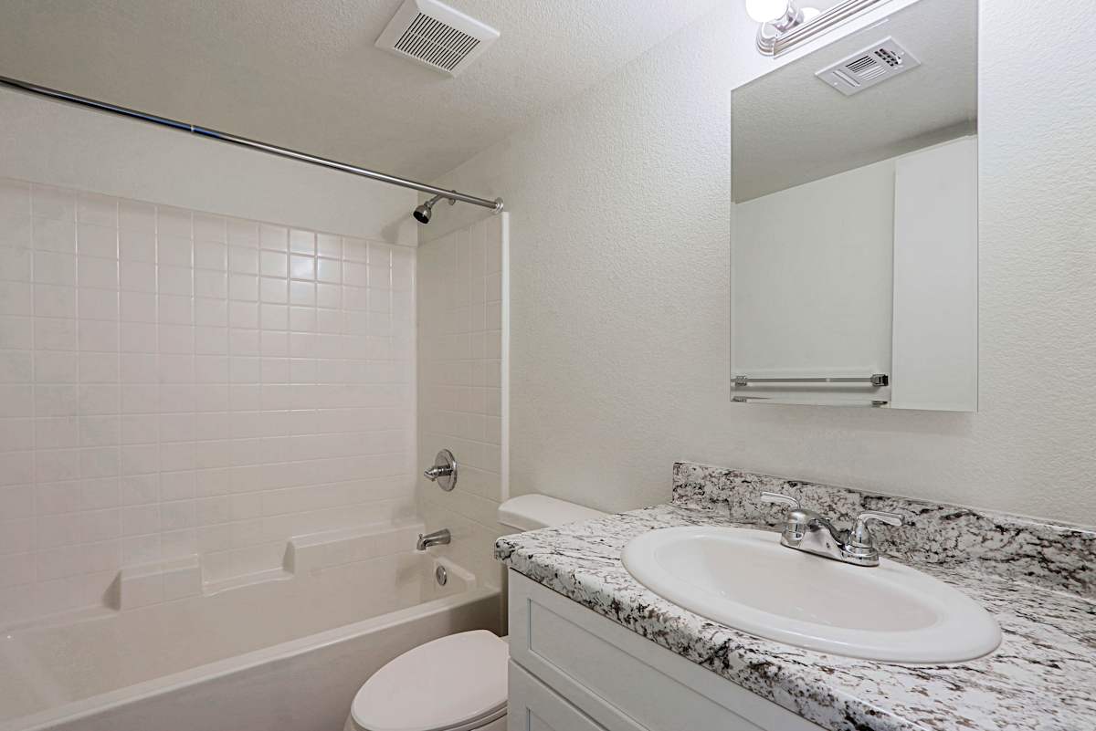 Apartment bathroom — representative home at Cinnabar Square.
