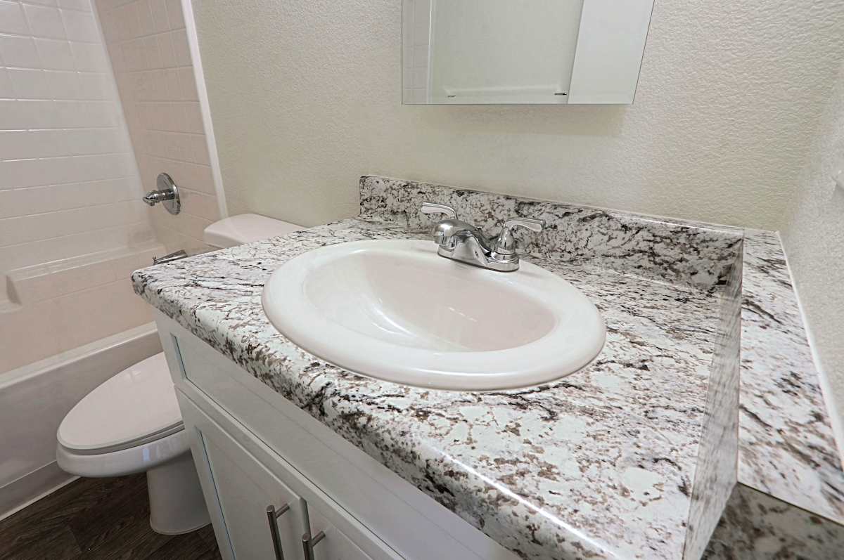 Apartment bathroom — representative home at Cinnabar Square.