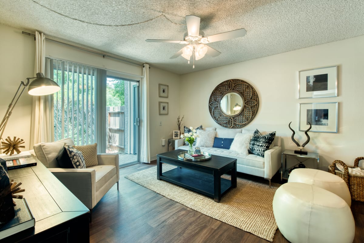 Furnished living room with patio doors — view 1 at Connect on Northern Apartments.
