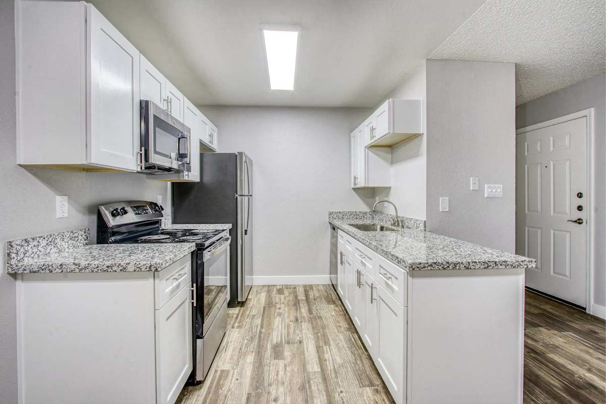 Apartment kitchen — representative home at Aspire Desert West.