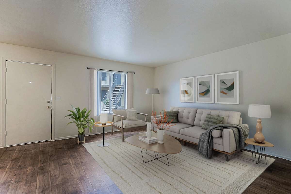 Furnished apartment living area shown — representative home at Sahuaro West Apartments.