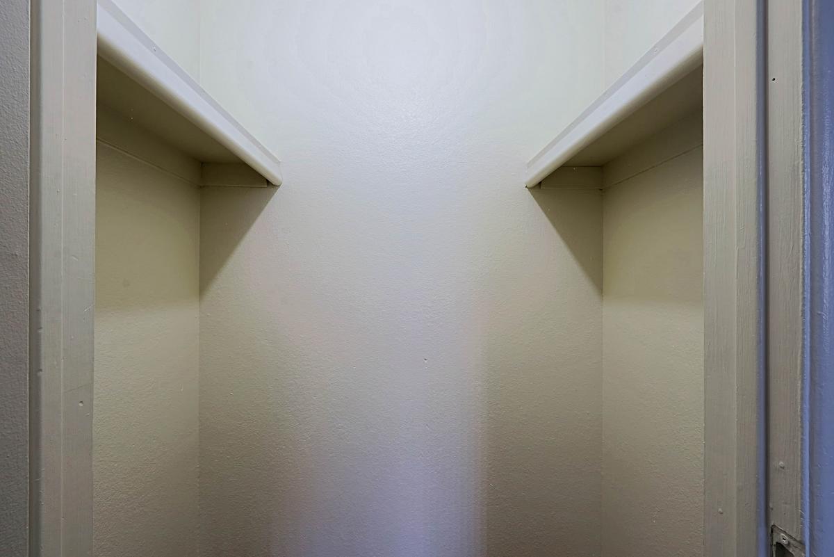 Walk-in closet — representative home at Sahuaro West Apartments.