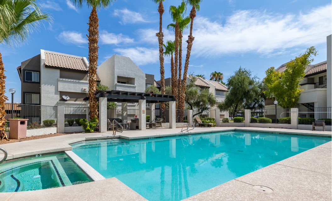 Swimming pool framed by apartment buildings — view 1 at Galleria Apartments.