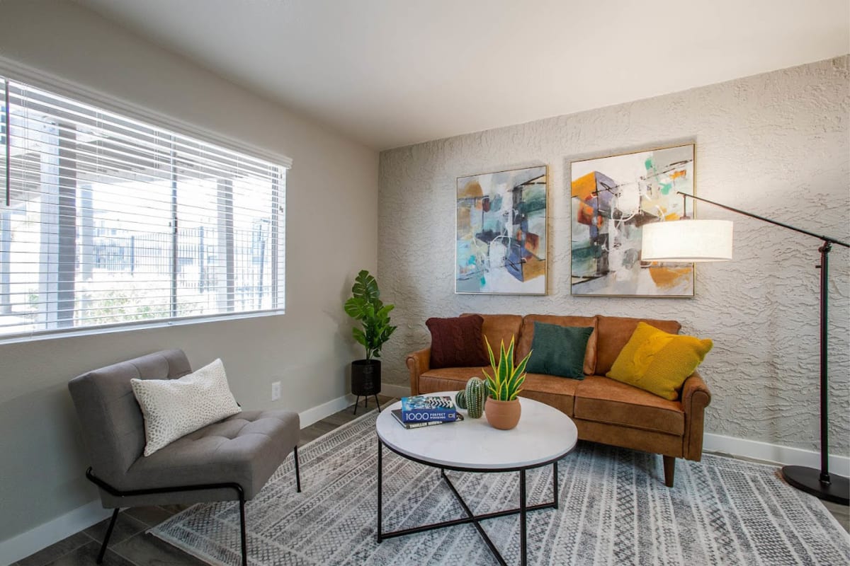 Furnished apartment living area shown — representative home at Ascent 1829.