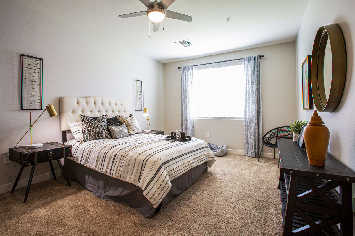 Furnished bedroom shown — representative home at Senderos at South Mountain.