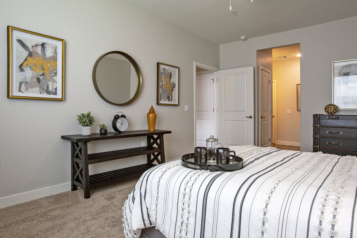 Furnished bedroom shown — representative home at Senderos at South Mountain.