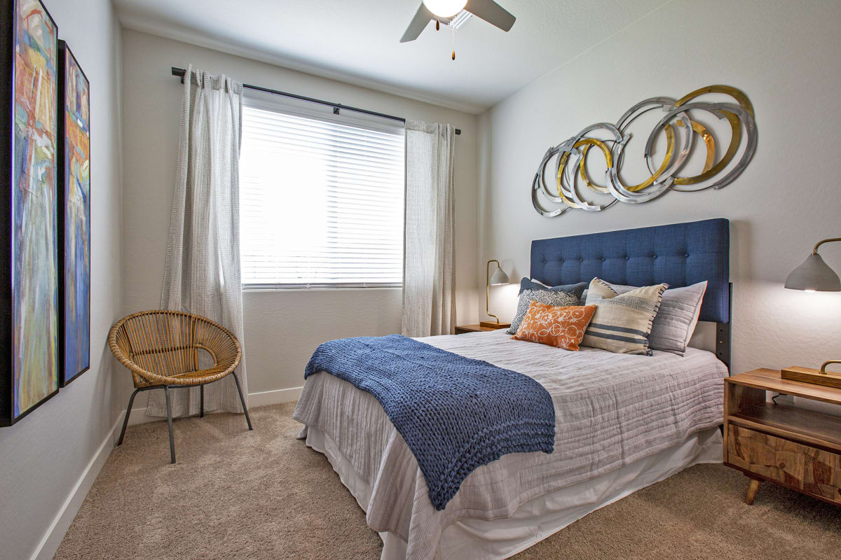 Furnished bedroom shown — representative home at Senderos at South Mountain.
