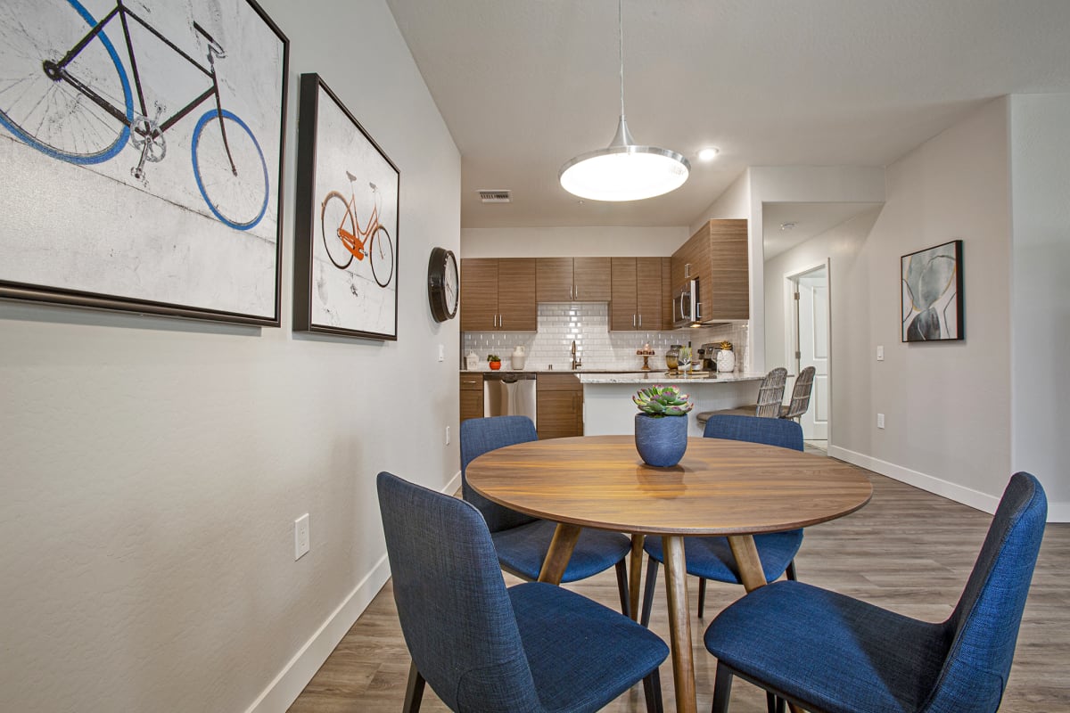 Furnished dining area shown — representative home at Senderos at South Mountain.