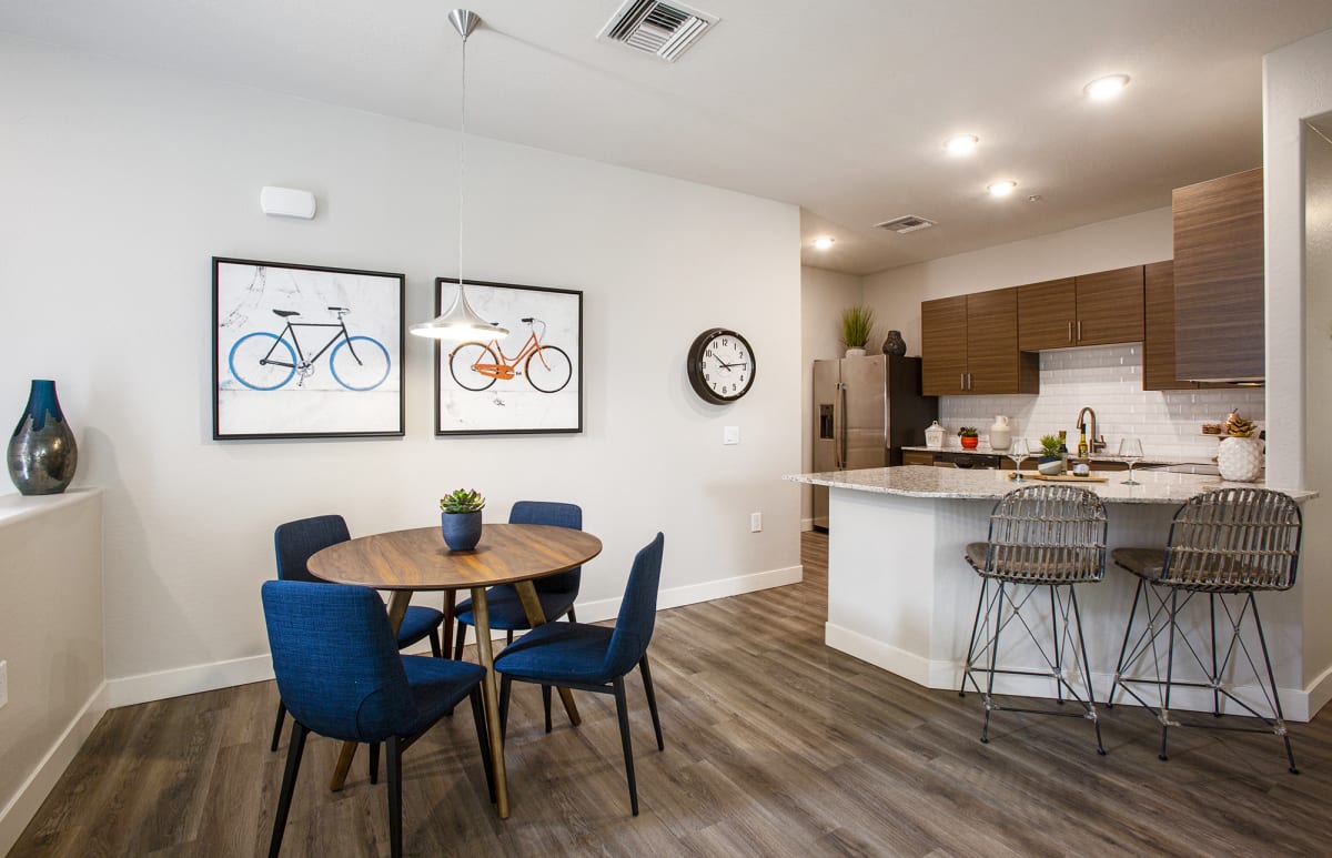 Furnished dining area shown — representative home at Senderos at South Mountain.