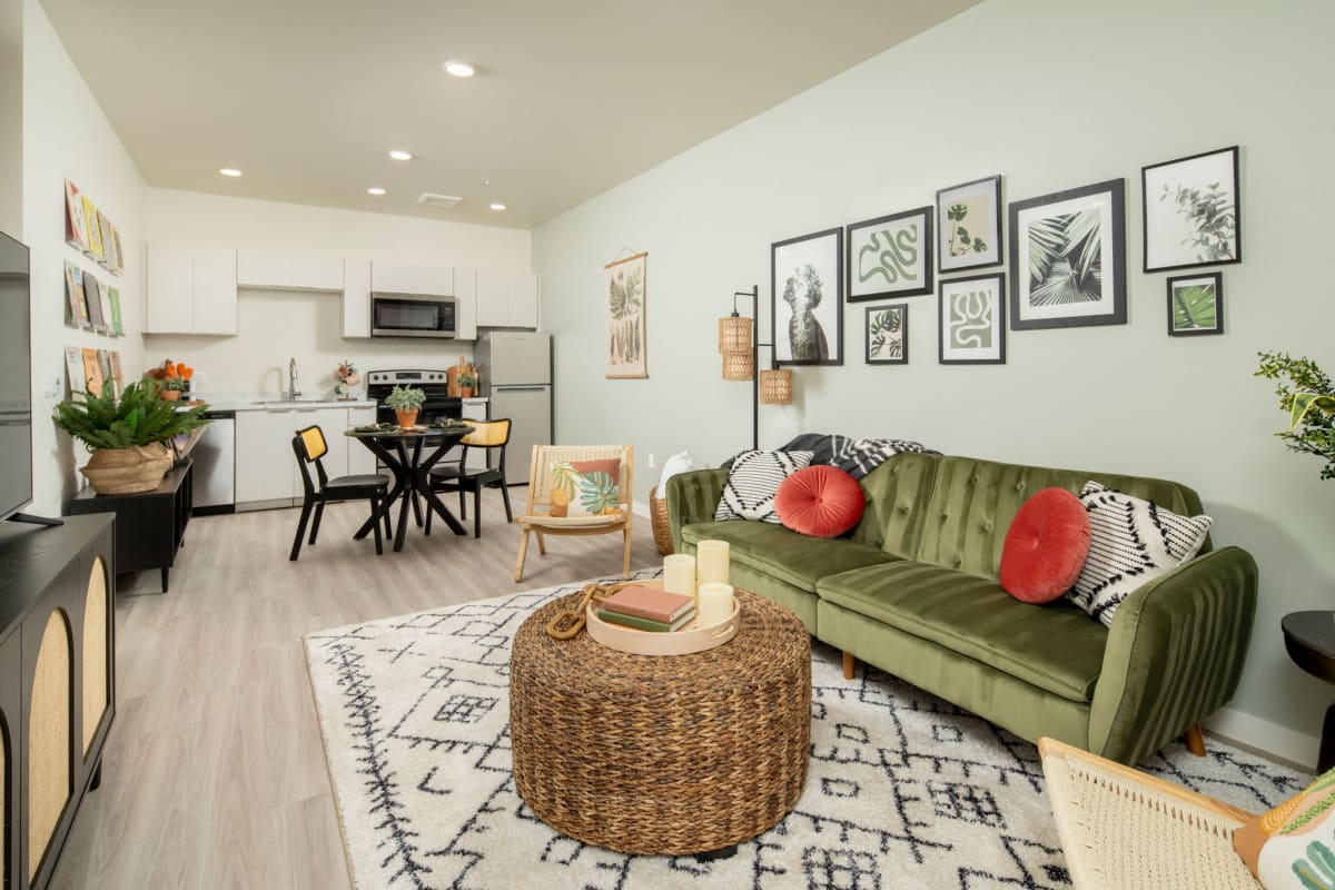 Furnished apartment living area shown — representative home at Streamliner 67th.