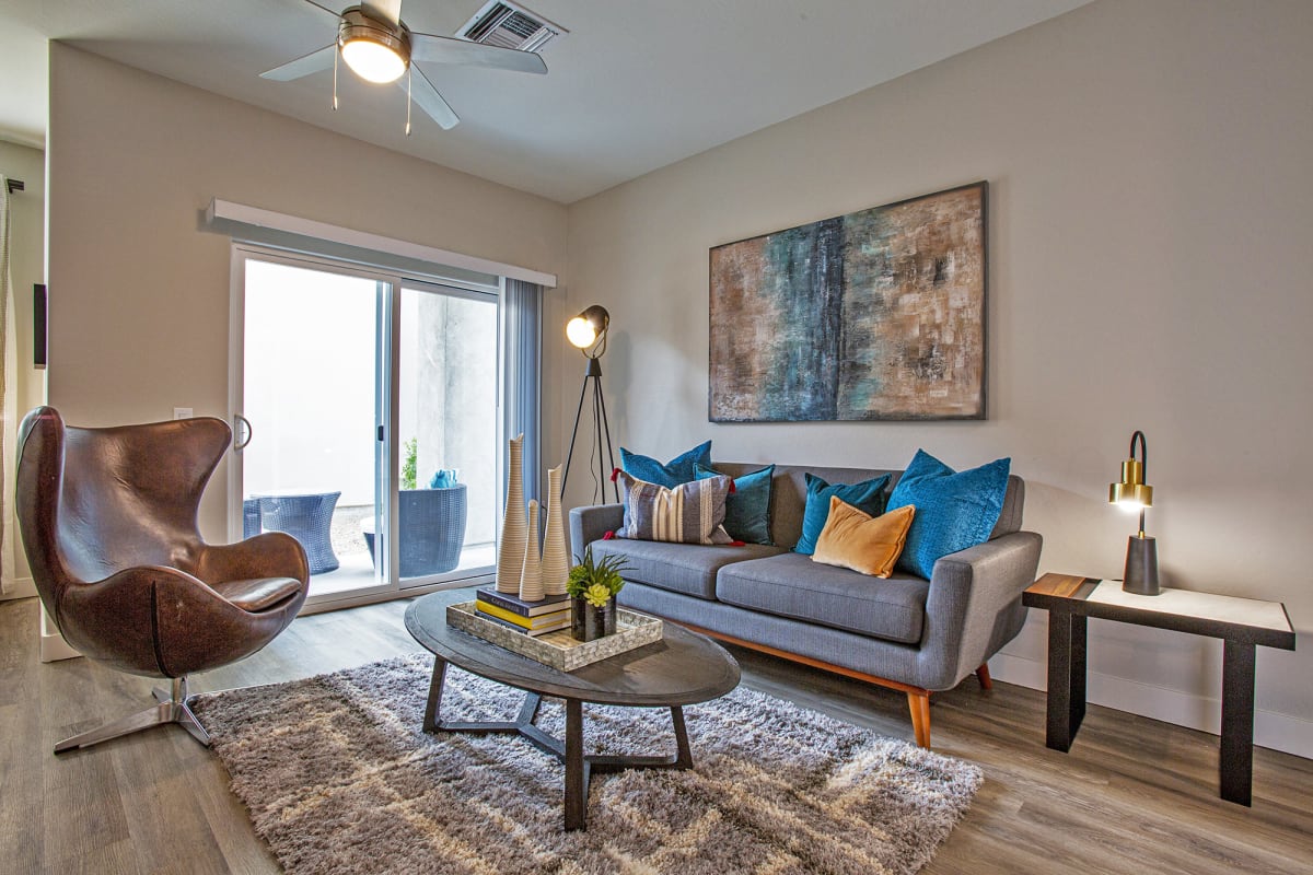 Furnished apartment living area shown — representative home at Senderos at South Mountain.