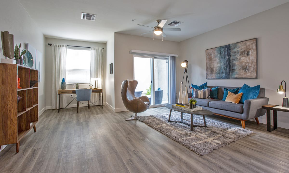 Furnished apartment living area shown — representative home at Senderos at South Mountain.