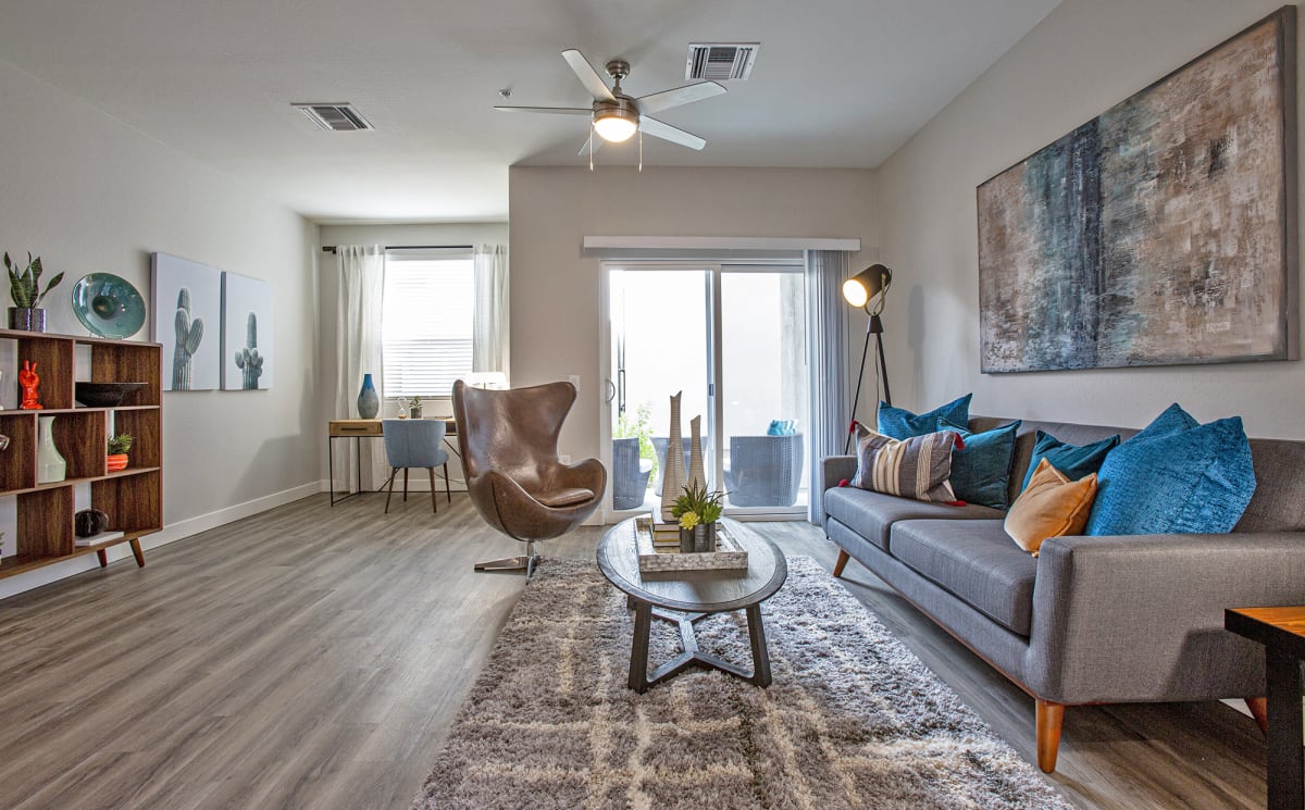 Furnished apartment living area shown — representative home at Senderos at South Mountain.