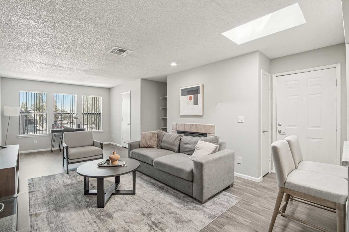 Furnished apartment living area shown — representative home at Enclave at Paradise Valley.
