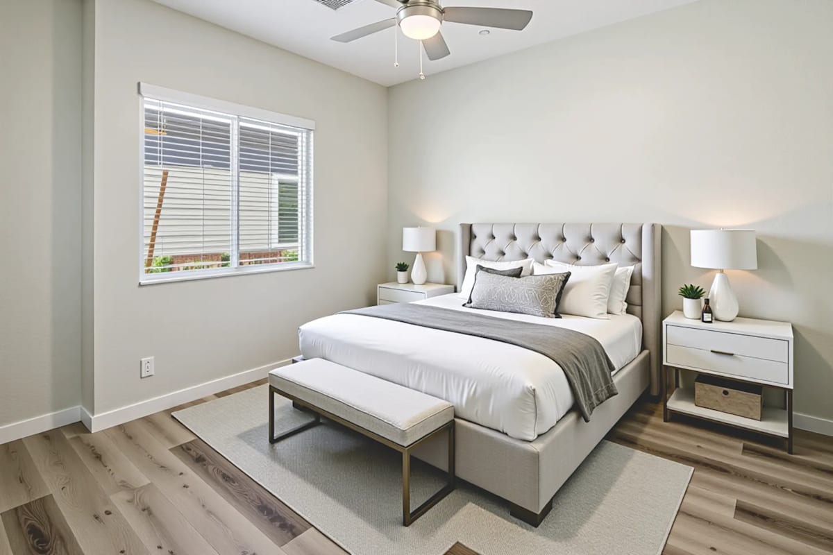 Furnished bedroom shown — representative home at LINQ at South Mountain.