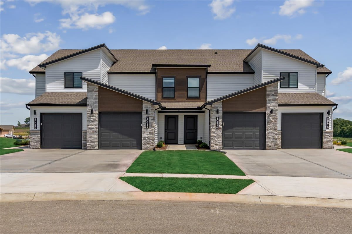 Hidden Hills Townhomes exterior with garages - Spring Hill, KS