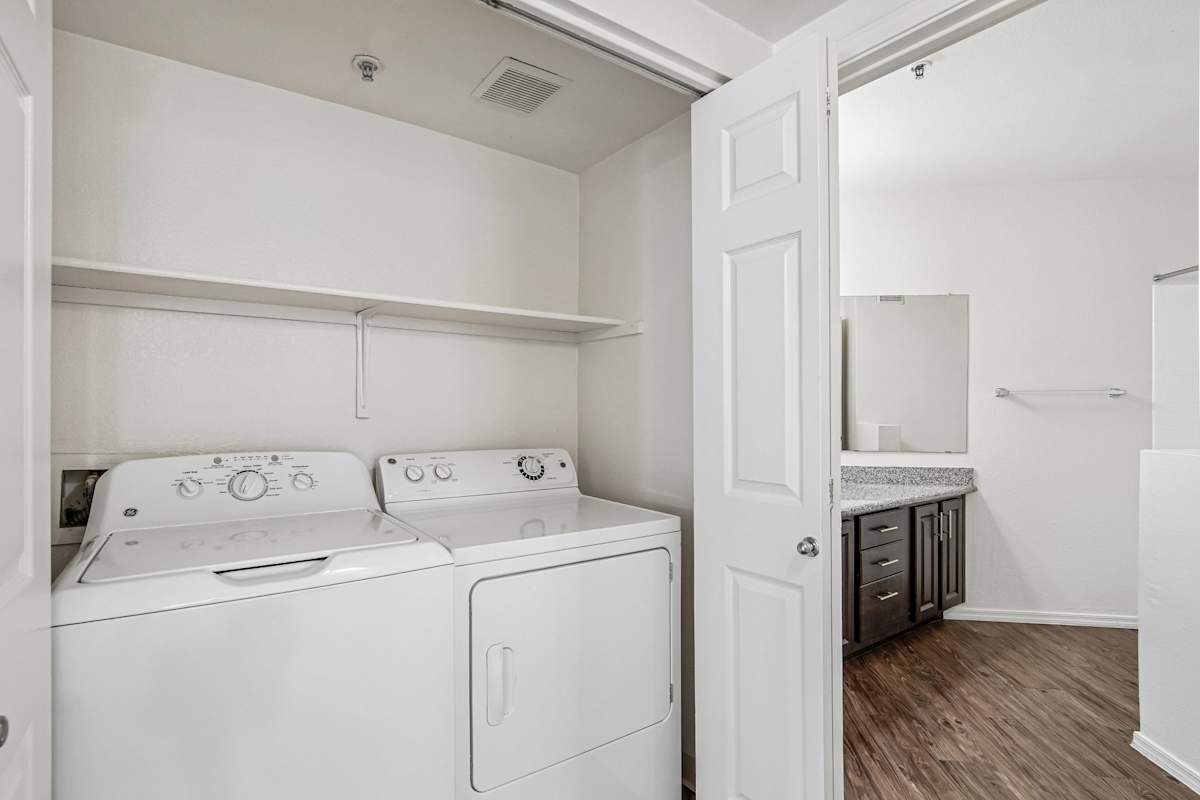 In-home laundry area — representative home at Ingleside Apartments.