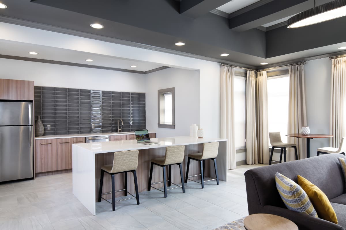 The Wren at Sharon resident lounge with kitchen and seating - Sharon, MA