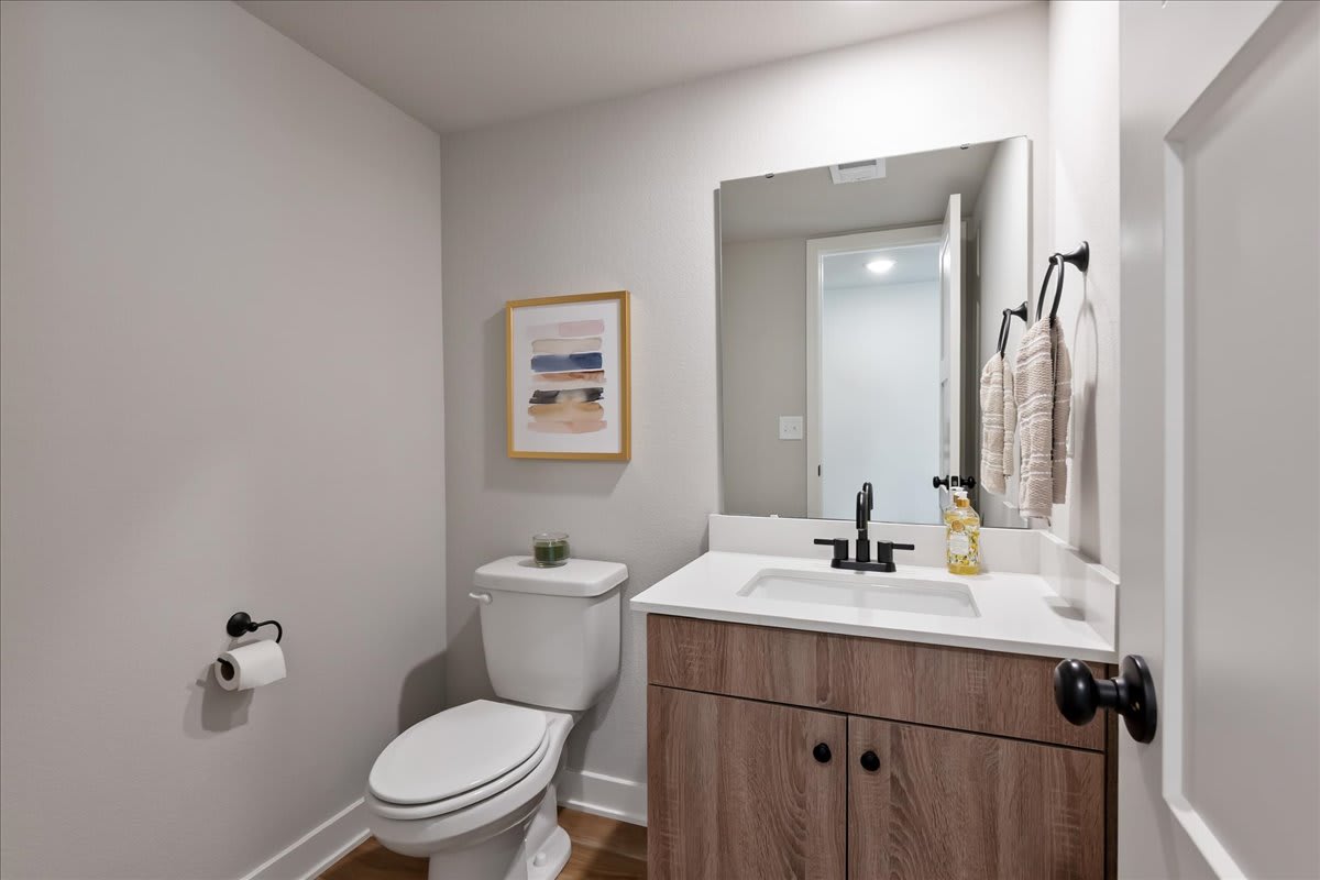 Hidden Hills Townhomes bathroom sink and mirror - Spring Hill, KS