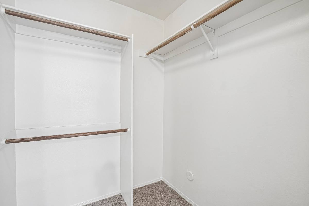 Walk-in closet — representative home at Ingleside Apartments.