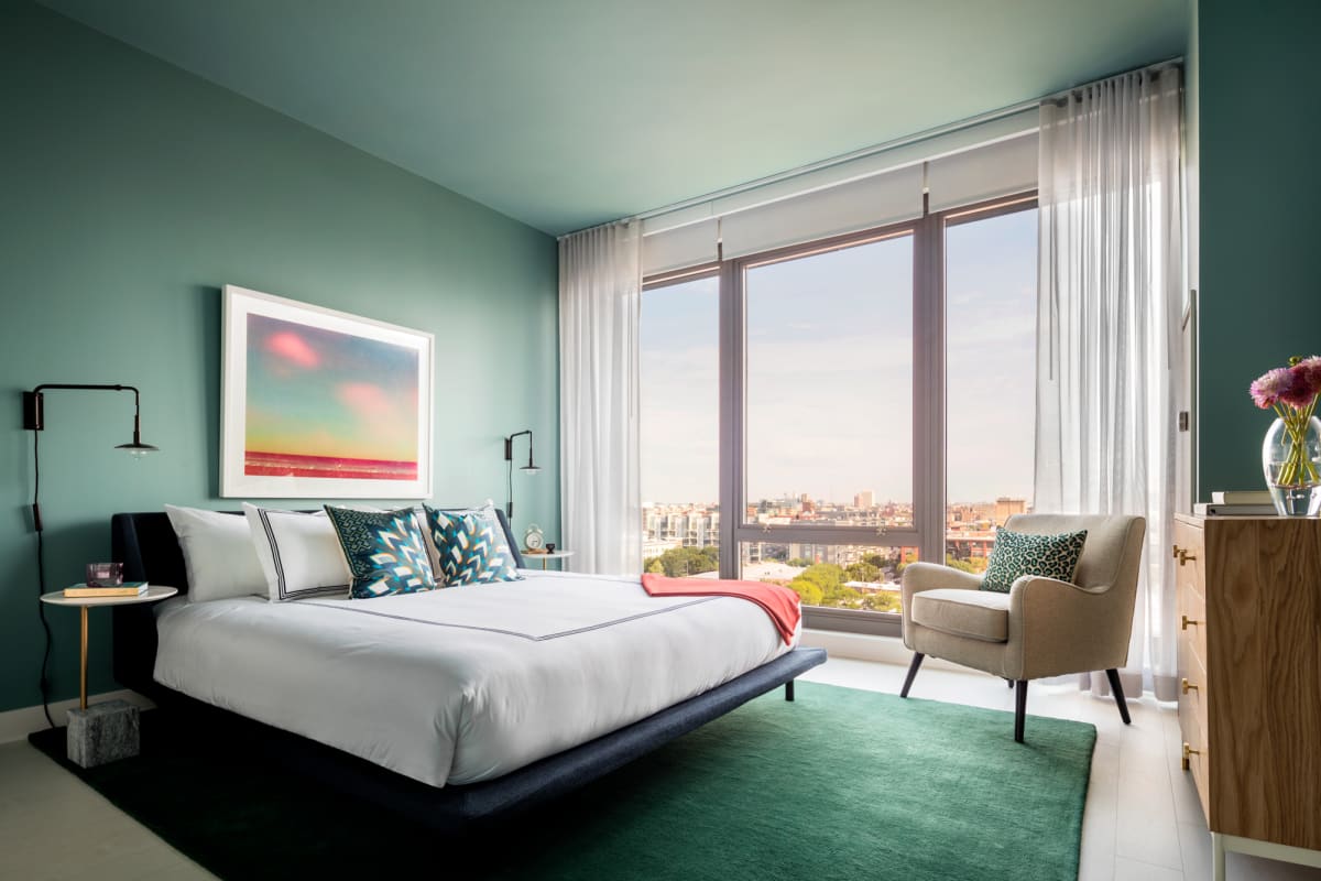 Landmark West Loop two-bedroom primary bedroom with city views - Chicago, IL