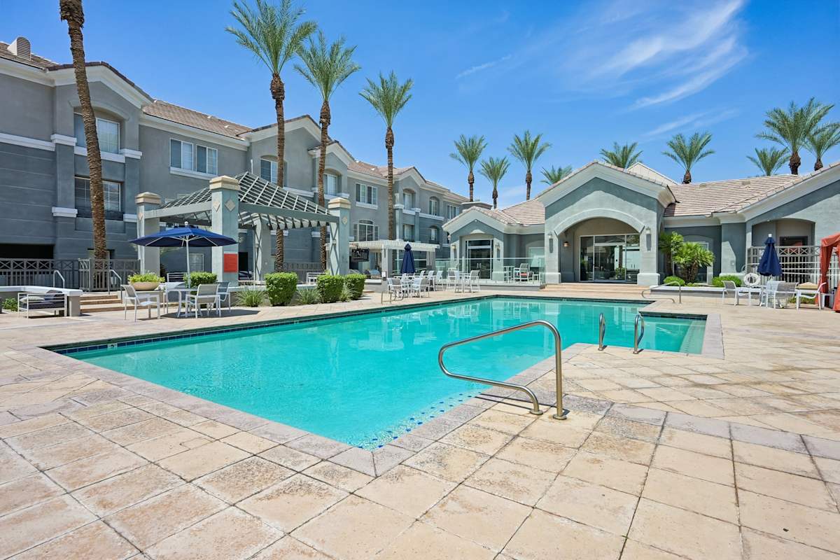 The Highland swimming pool with palm trees - Phoenix, AZ