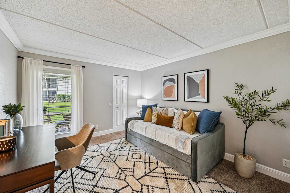 Palm Court at Wellington Apartments living room with couch - Wellington, FL