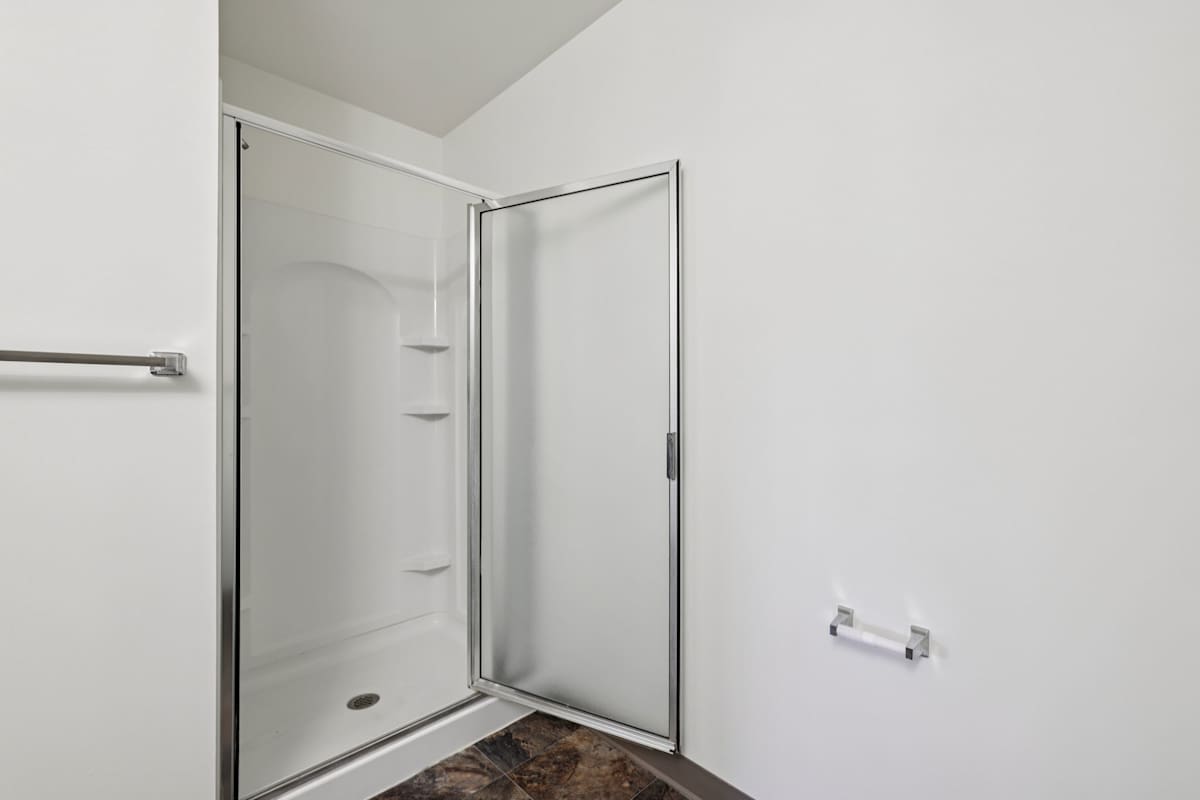 The Residences at Seven Gables bathroom with glass shower - Carlisle, PA