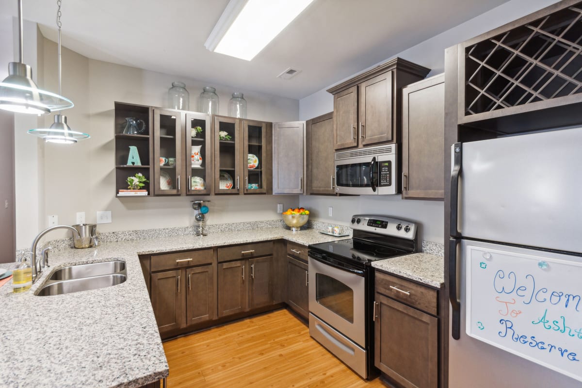 Ashton Reserve at NorthLake apartment kitchen with granite counters - Charlotte, NC