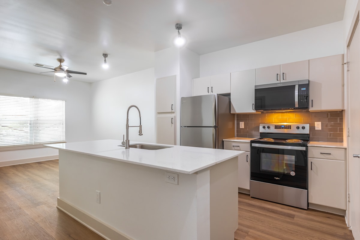 5225 Maple Avenue modern kitchen with stainless appliances - Dallas, TX