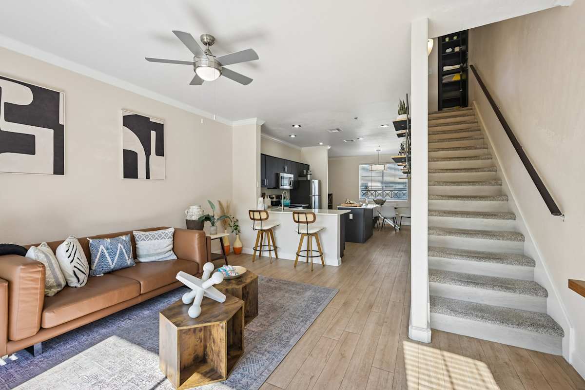 Furnished apartment living area shown — representative home at The Highland.