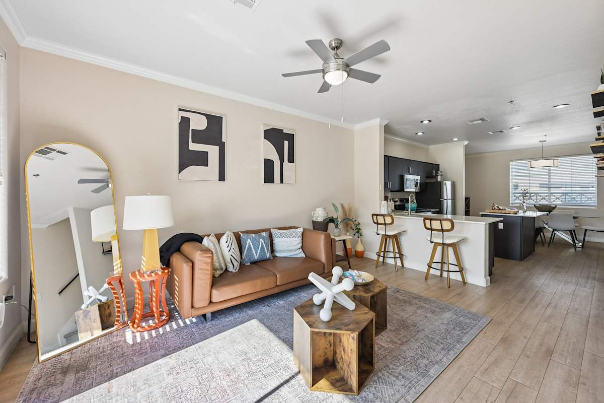Furnished apartment living area shown — representative home at The Highland.